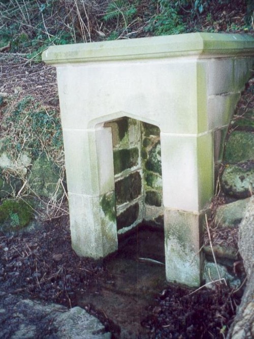 The restored holy well today, original stonework to rear with newer stone at the front