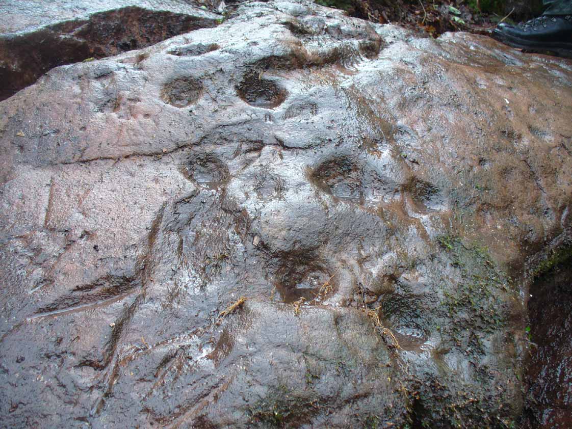 Large cupmarks on sloping face